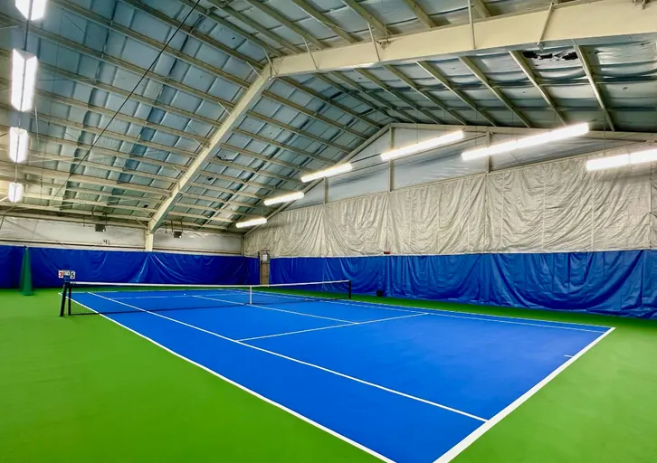 An Image of Tennis Courts at Hazelmere Golf & Tennis Club in Surrey