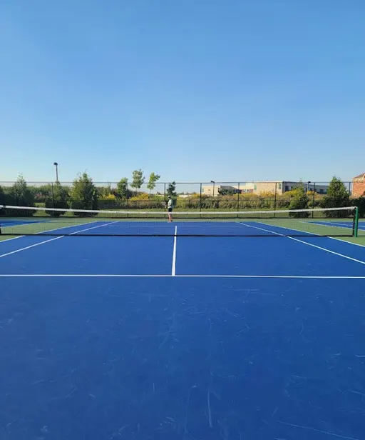 An Image of Tennis Courts at Optimist Park in Milton