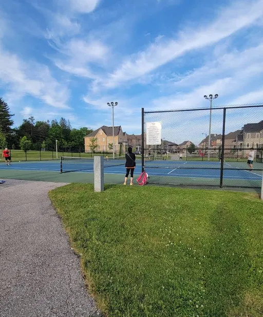 An Image of Tennis Courts at Twelve Oaks Park in Maple