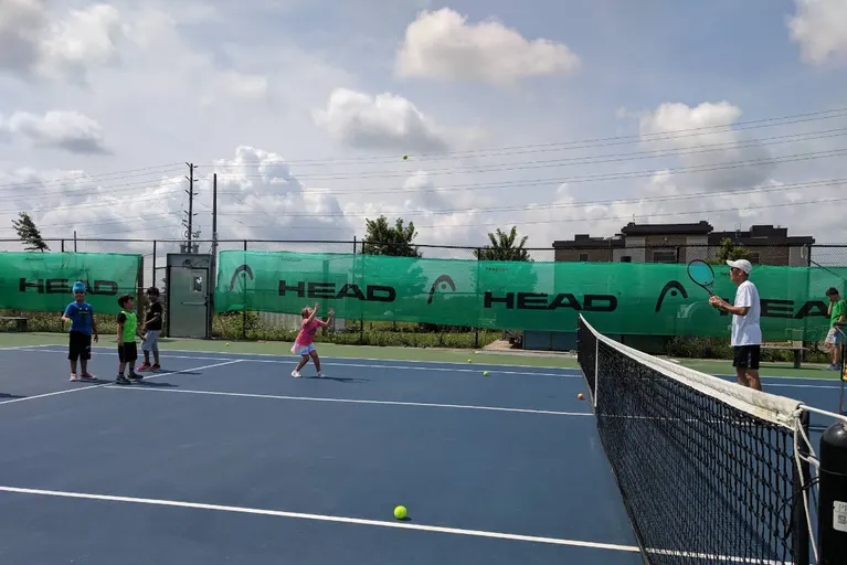 A picture representing the tennis lessons run by The Tennis School